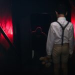 man in gray dress shirt standing