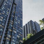 High-rise buildings stand tall against a cloudy sky.