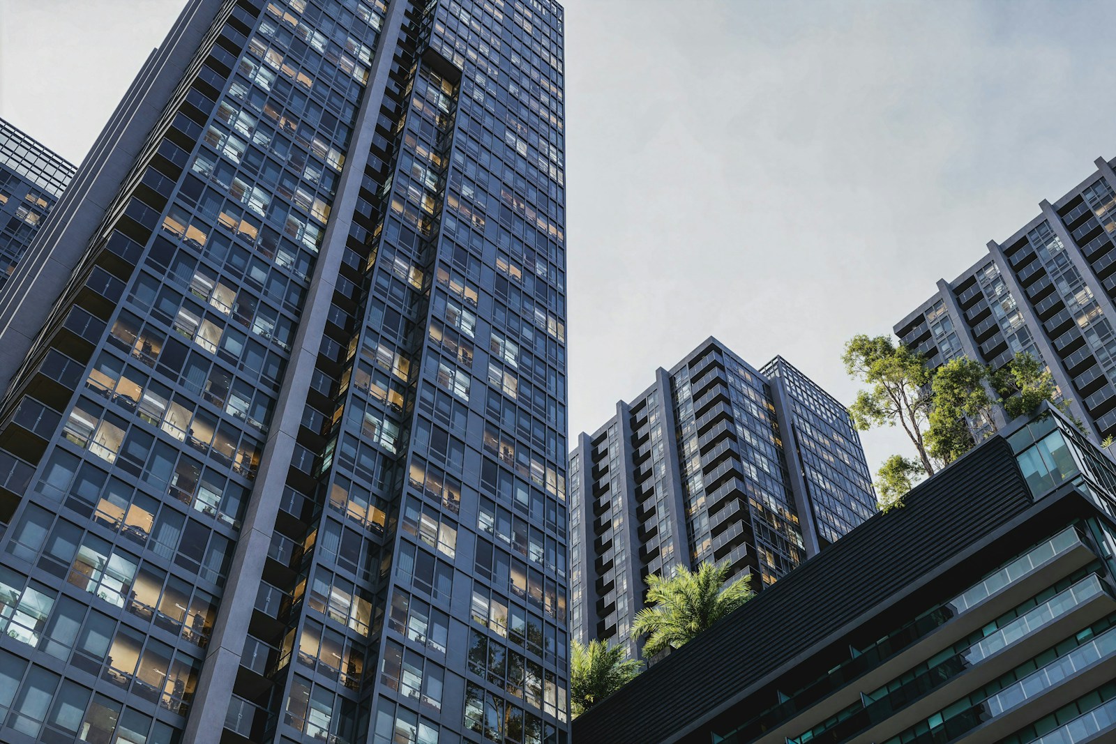High-rise buildings stand tall against a cloudy sky.