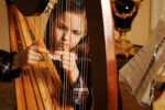girl playing harp