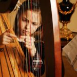 girl playing harp