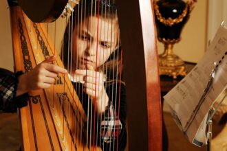 girl playing harp